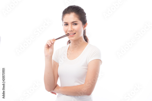 half asian woman eating snack on white background