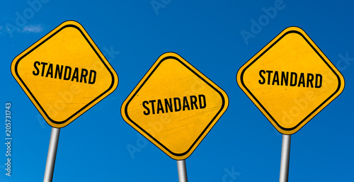 standard - yellow sign with blue sky photo