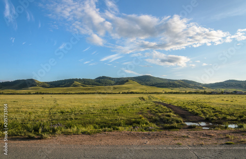 Sunny summer landscape, hills, forest, blue sky