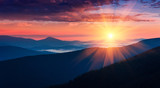 Panoramic view of colorful sunrise in mountains. Concept of the awakening wildlife, romance,emotional experience in your soul, joy in mundane life.