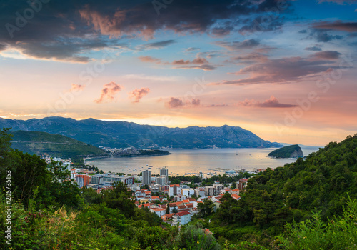 Panoramic landscape of Budva riviera in Montenegro at sunrise. Dramatic morning light. Balkans, Adriatic sea, Europe. View from the top of the mountain. 