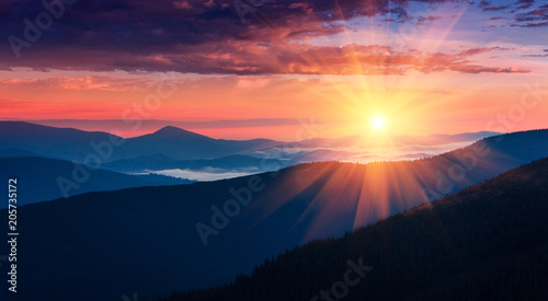 Tablou Canvas Panoramic view of colorful sunrise in mountains