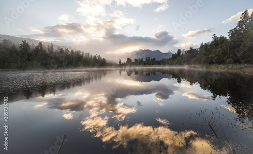 Bild auf Leinwand New Zealand lake view refection with morning sunrise sky