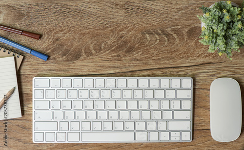 mock up white keyboard and mouse on wooden table photo