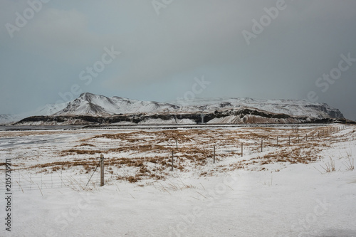 Dramatic icelandic landscape with snow covered mountains. Cold winter day in Iceland.