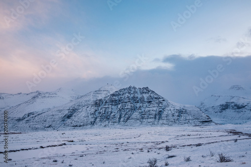 Dramatic icelandic landscape with snow covered mountains. Cold winter day in Iceland.