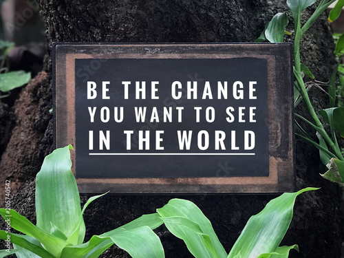 Motivational and inspirational quote - Be the change you want to see in the world. With vintage styled background. photo