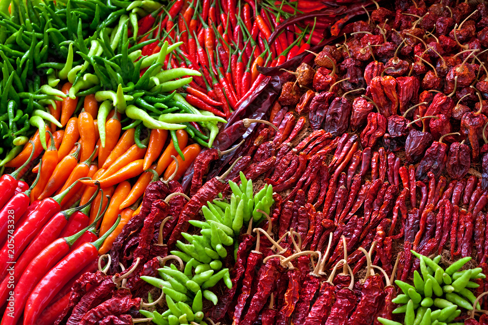 Fototapeta premium Heap Of Ripe Big Red Peppers At A Street Market In thailand
