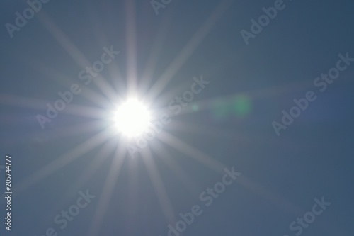 Background shining sun with solar flares