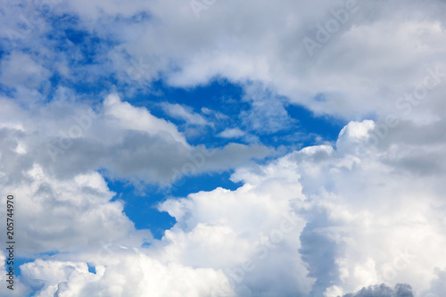 Very beautiful unusual blue sky with beautiful white clouds as natural abstract fresh atmospheric blue and white background