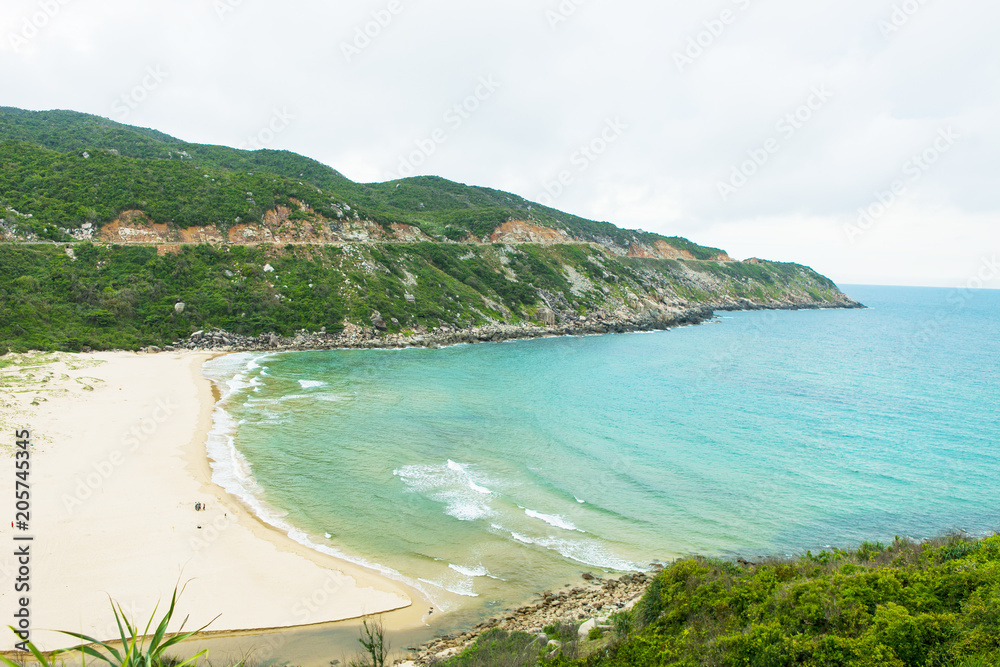Fototapeta premium Beautiful Vietnam landscape, amazing and wonderful beach with mountain around, fresh air, nice view for Asian travel, ecology environment at sea area, Phu Yen have many scene for tourist at Viet Nam