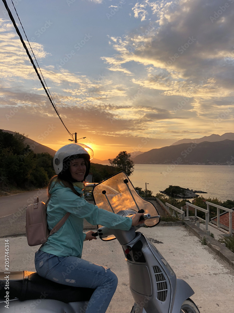 Obraz premium Girl on bike scooter in Montenegro