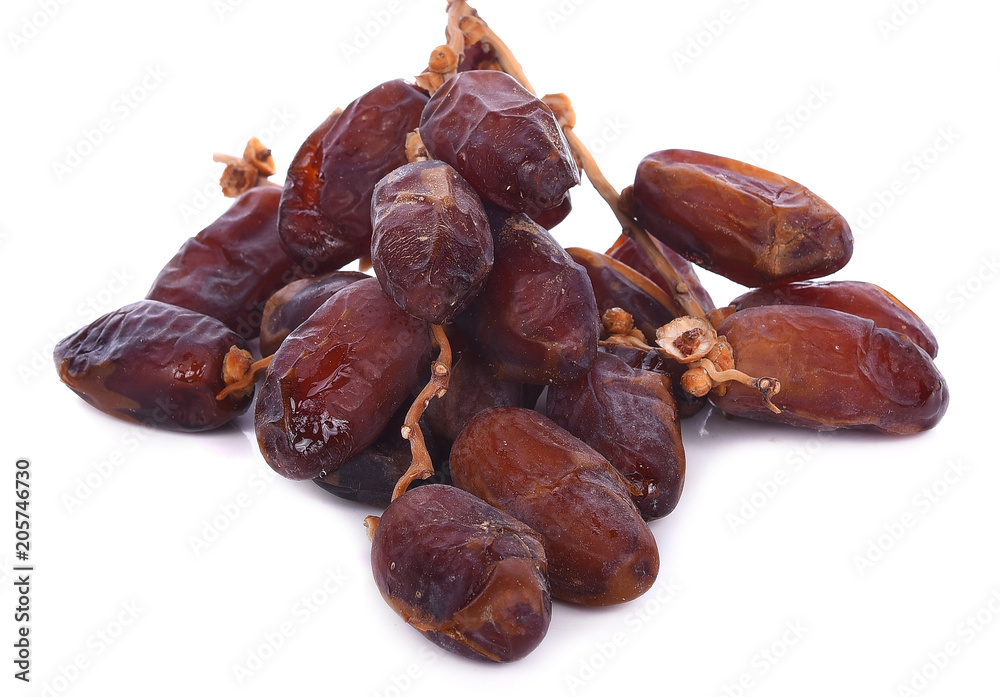 Delicious fresh organic dates over white background Delicious fresh organic dates over white background
