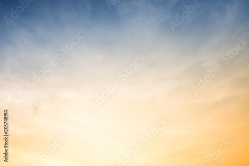 Sunset with sun rays and clouds background. © Zenzeta