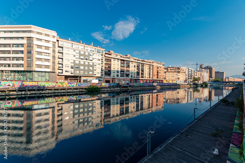 Edificios reflejados en el Guadalmedina. Malaga. España