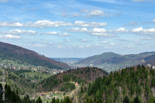 Small village in the Carpathian mountains in a valley surrounded by forests. Soft focus. Beautiful plan.
