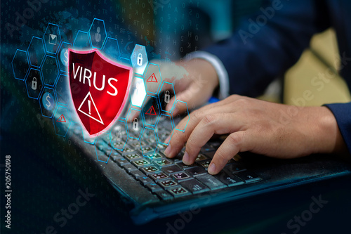 Press enter button on the keyboard computer Protective shield virus red Exclamation Warning Caution Computer in dark with word virus