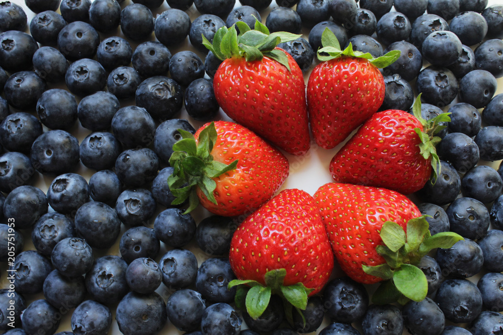 Obraz premium Strawberries and blueberries display.