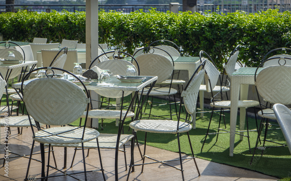 Chairs and tables of a restaurant seating outside