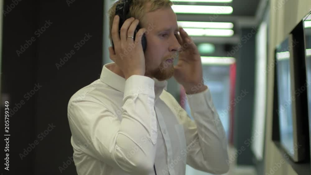 male in headphones at the Museum of Modern Art male in headphones at the Museum of Modern Art