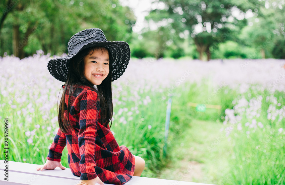 Portrait of beautiful asian child feel happy green background