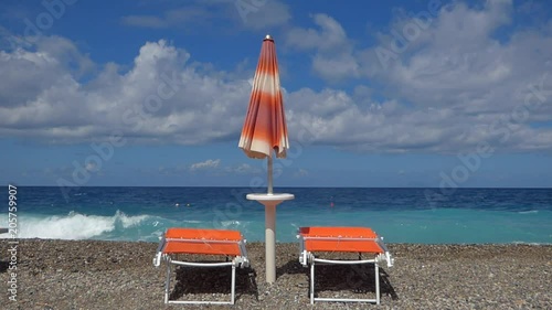 Beach with deckchairs and sunshade