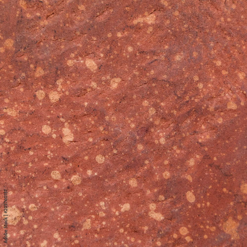 Fototapeta premium Red rough stone texture background. Material construction and architectural detail.