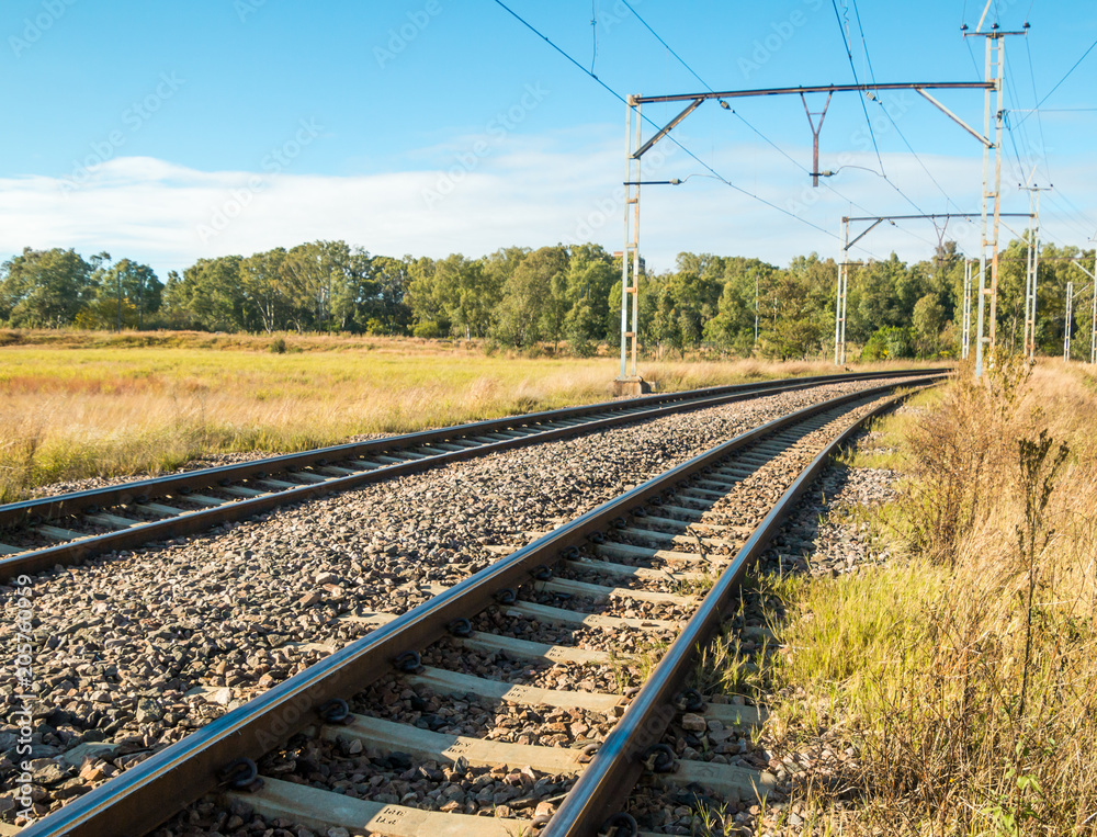 Electric railway lines going through a rural landscape Electric railway lines going through a rural landscape