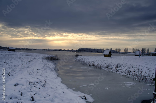 frozen lake in winter at sunset © Вячеслав Лелюга