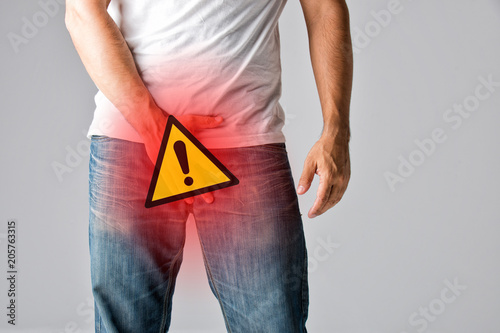 Man Covering his Crotch