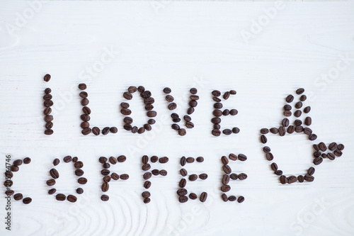 I Love Coffee phrase spelled out of roasted coffee beans isolated on white background