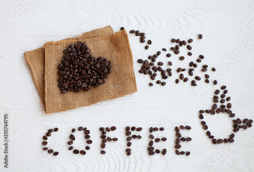 I Love Coffee phrase spelled out of roasted coffee beans isolated on white background
