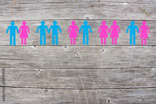Gay lesbian and straight couples on wooden background