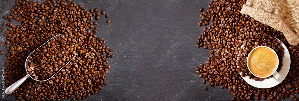 cup of coffee and coffee beans in a sack, top view