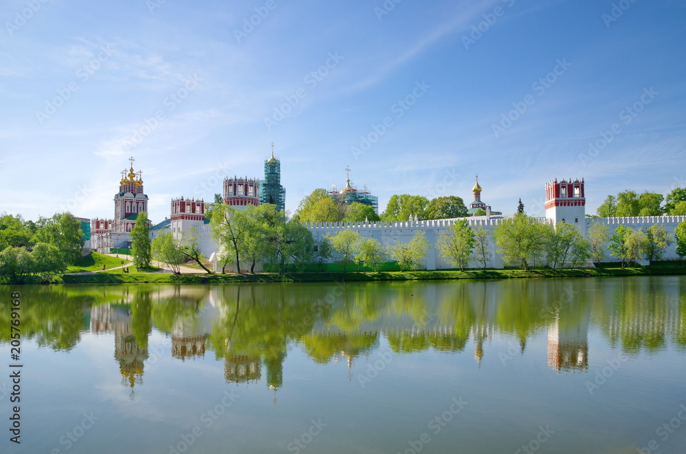 Panoramic view of the Novodevichy Convent, also Bogoroditse-Smolensky Monastery from the pond in Moscow city, Russia
