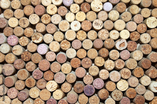 Corks from red wine and cork from white wine as abstract background from wine corks