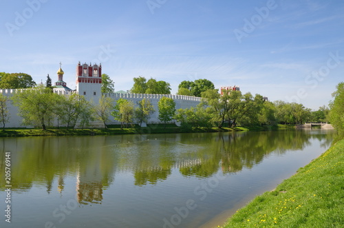Spring view of the Novodevichy Convent, also Bogoroditse-Smolensky Monastery from the pond in Moscow city, Russia