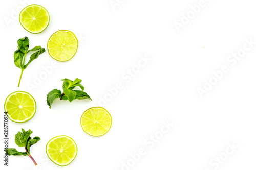 Citrus frame. Lime round slices composition on white background top view copy space