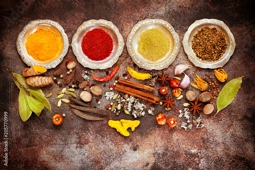 Indian spices on a concrete background, top view, flat lay