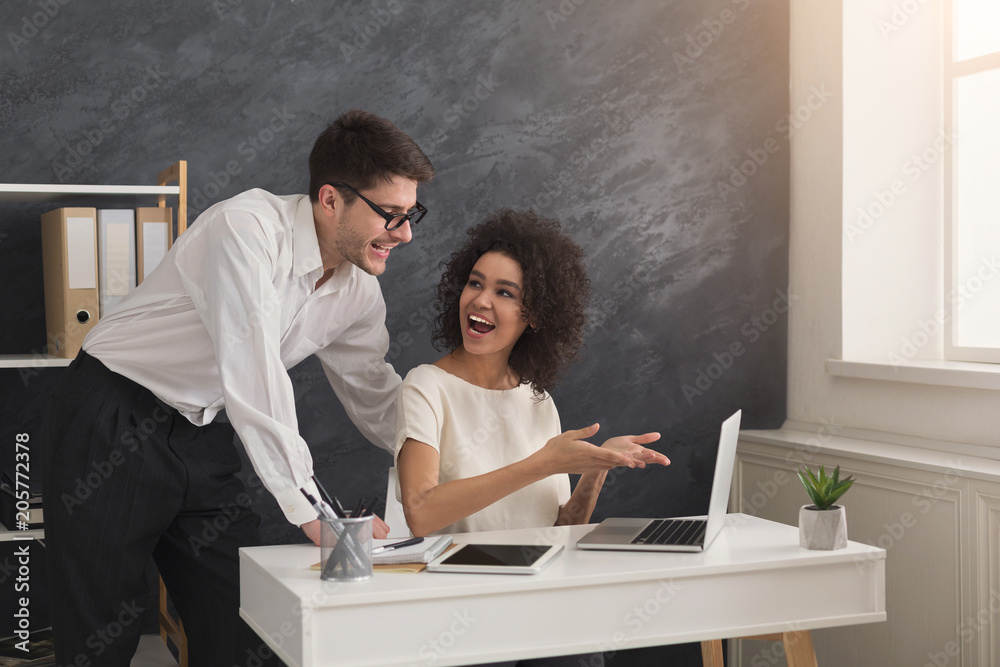 Couple of business partners work at modern office Couple of business partners work at modern office