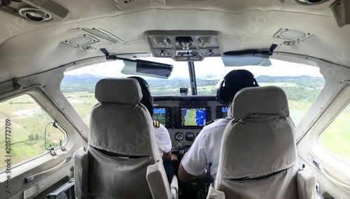 Pilots in cockpit during flight, Philippines, Coron, Palawan