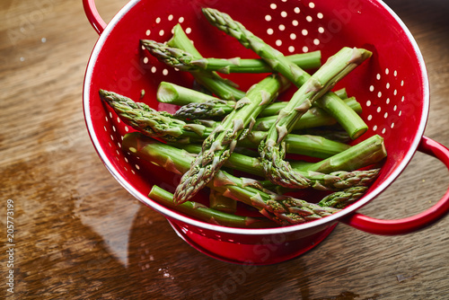 green asparagus on a red background