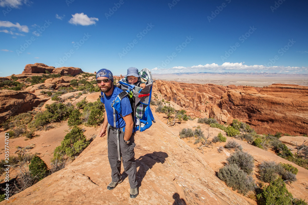A family with baby son visits Arches National Park in Utah, USA A family with baby son visits Arches National Park in Utah, USA