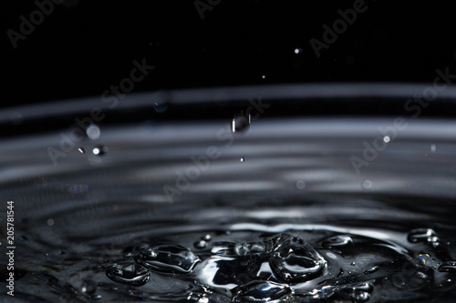 Texture of water with drops on a black background. macrophotography