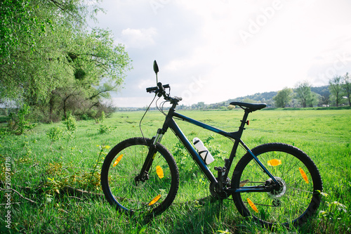 Sports bike on a spring sunny afternoon on a green meadow