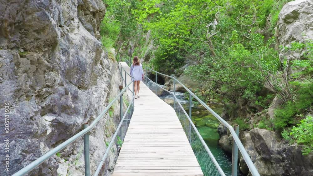 Young woman walks on observation deck. green Canyon, alanya turkey. Young woman walks on observation deck. green Canyon, alanya turkey.