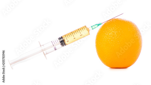 Syringe of orange on a white background isolation