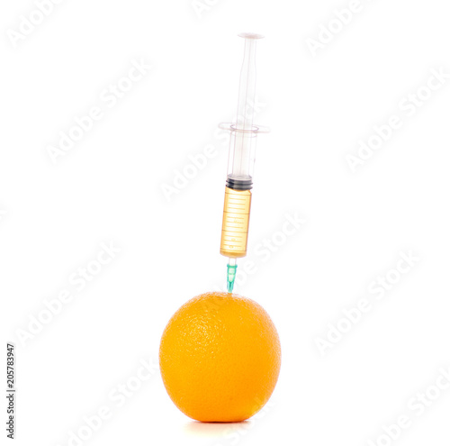 Syringe of orange on a white background isolation
