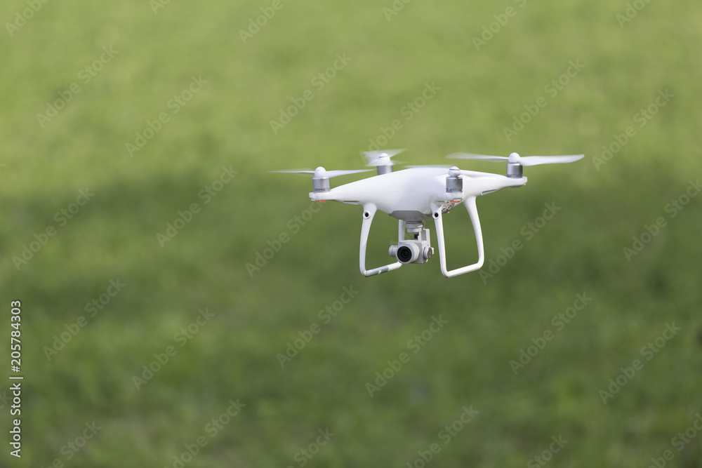 Modern drone flying outdoor, RF photo, no logos or trademarks Modern drone flying outdoor, RF photo, no logos or trademarks