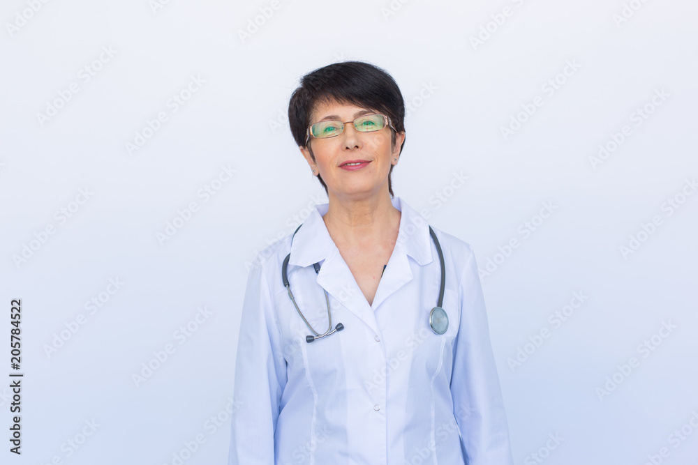 Portrait of an attractive young female doctor over white background Portrait of an attractive young female doctor over white background